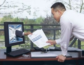 document management hand through monitor screen